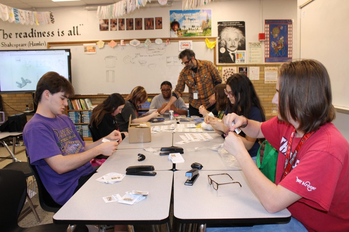 Environmental Club prepares seed bags to give out to the community.
